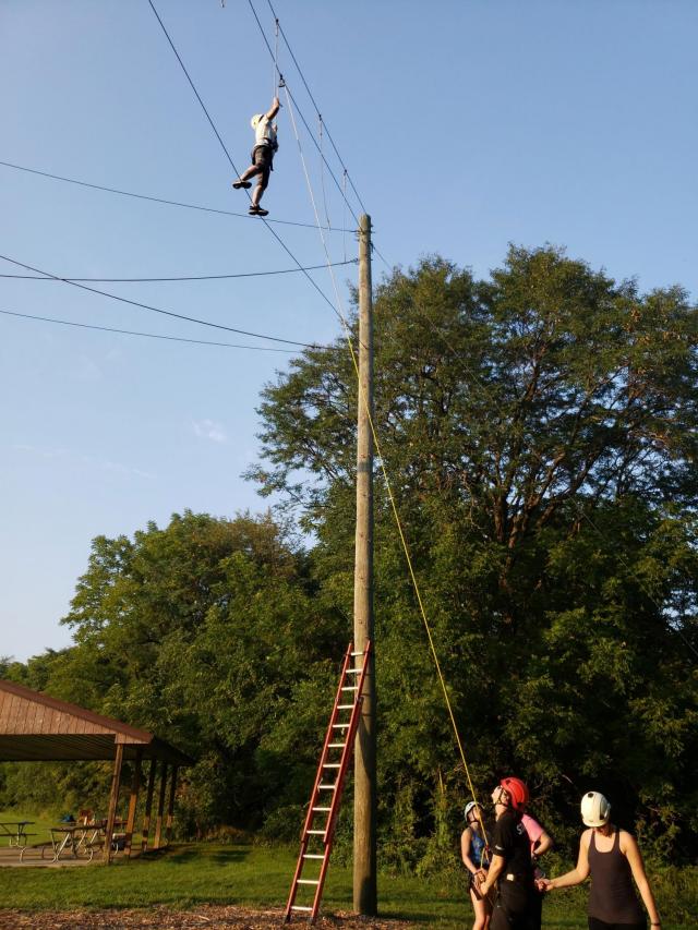 Jennifer Croker participates in an event hosted by PAVE at the UI Outdoor Creation Challenge Course. Team leader Tiffany Baker-Strothkamp says the event focused on the important of building a support network and trusting those you choose to be involved in your life.
